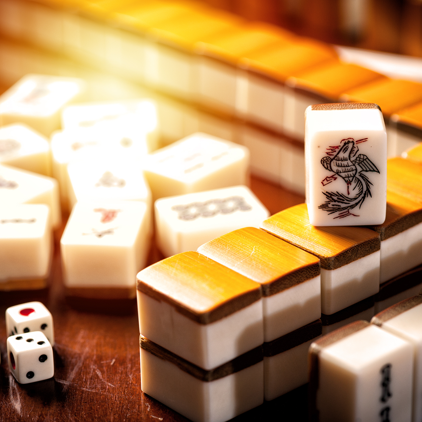 Close Up of a Mahjong tile with a bird on it